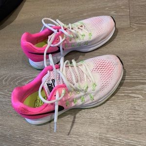 White and pink Nike running shoes